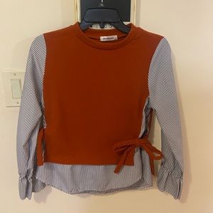 Orange vest with side bow ties with linen pants, striped blue shirt under it